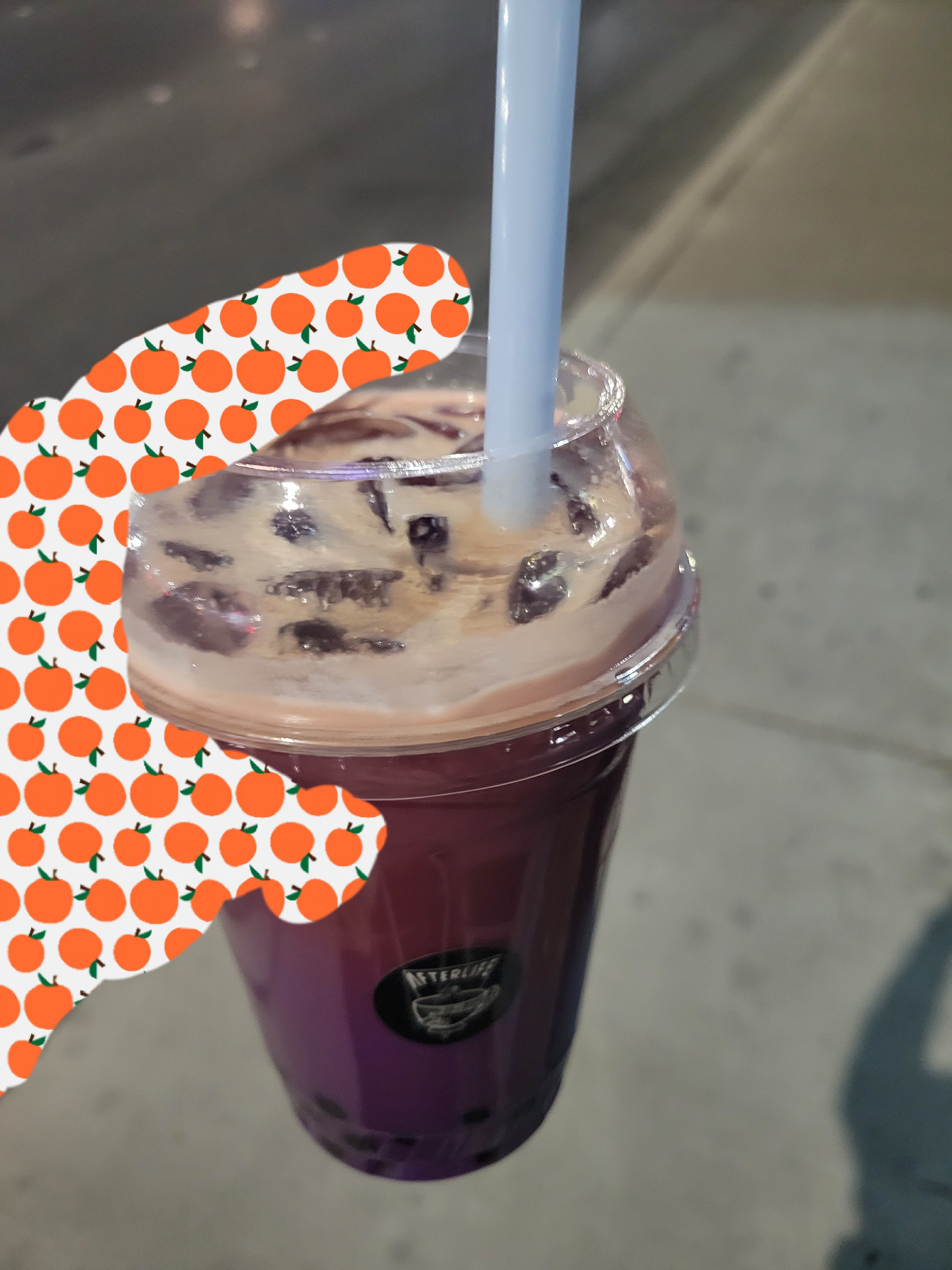 Plastic cup of boba tea with a straw.